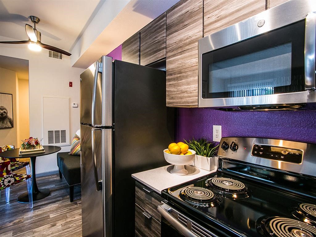 a kitchen with a stove and a microwave