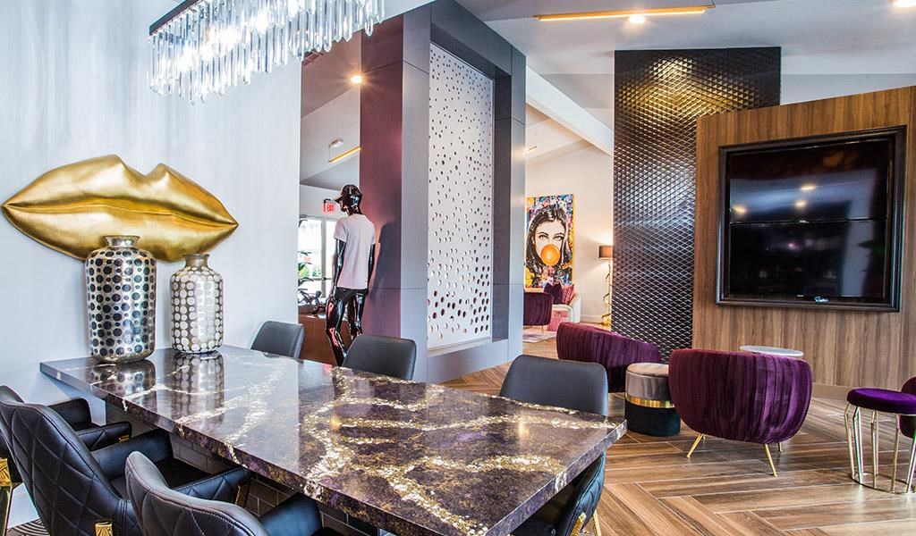 a dining room with a table and chairs and a television