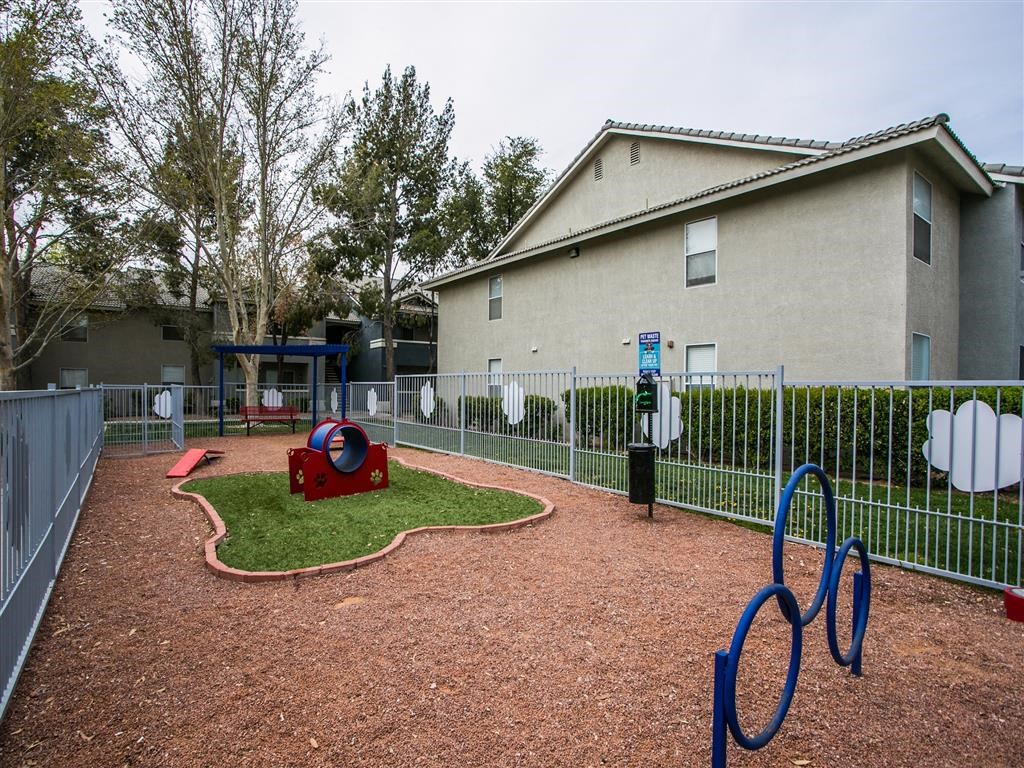 a playground at a home with a blue playground equipment