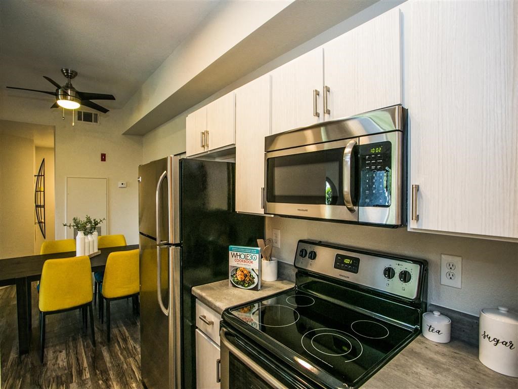 a kitchen with a stove and a microwave