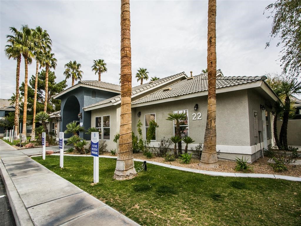 a house with palm trees in front of it