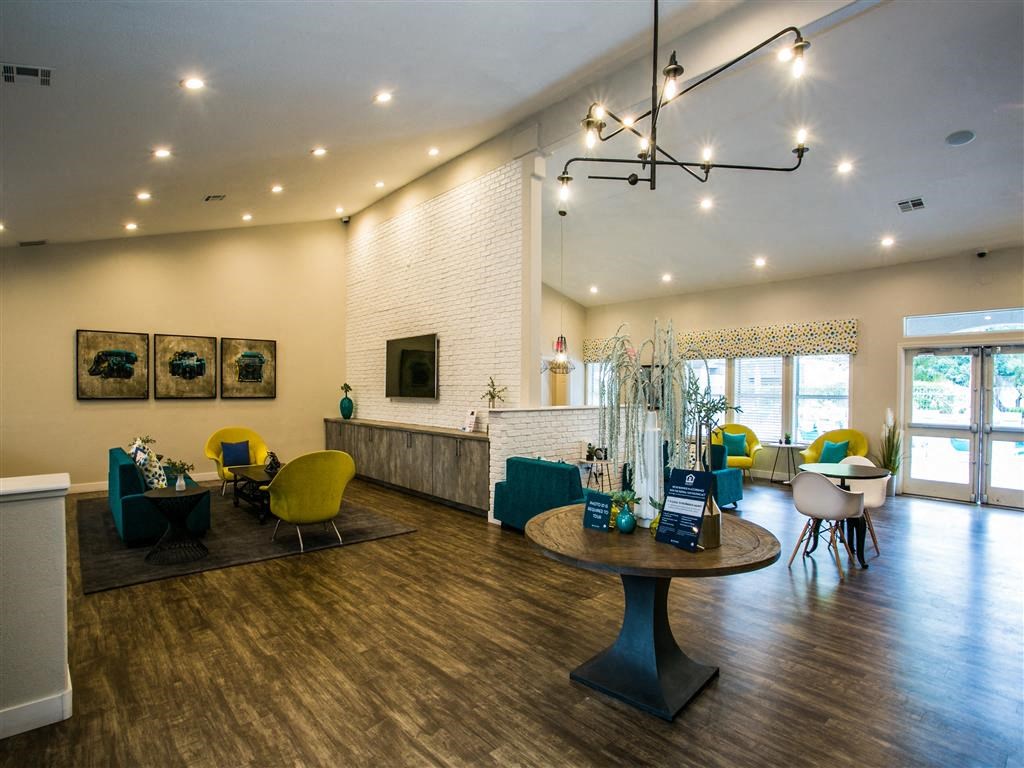 a living room with a table and chairs