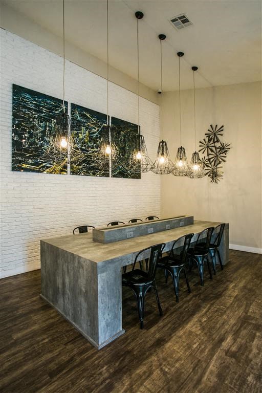 a dining room with a long table and chairs