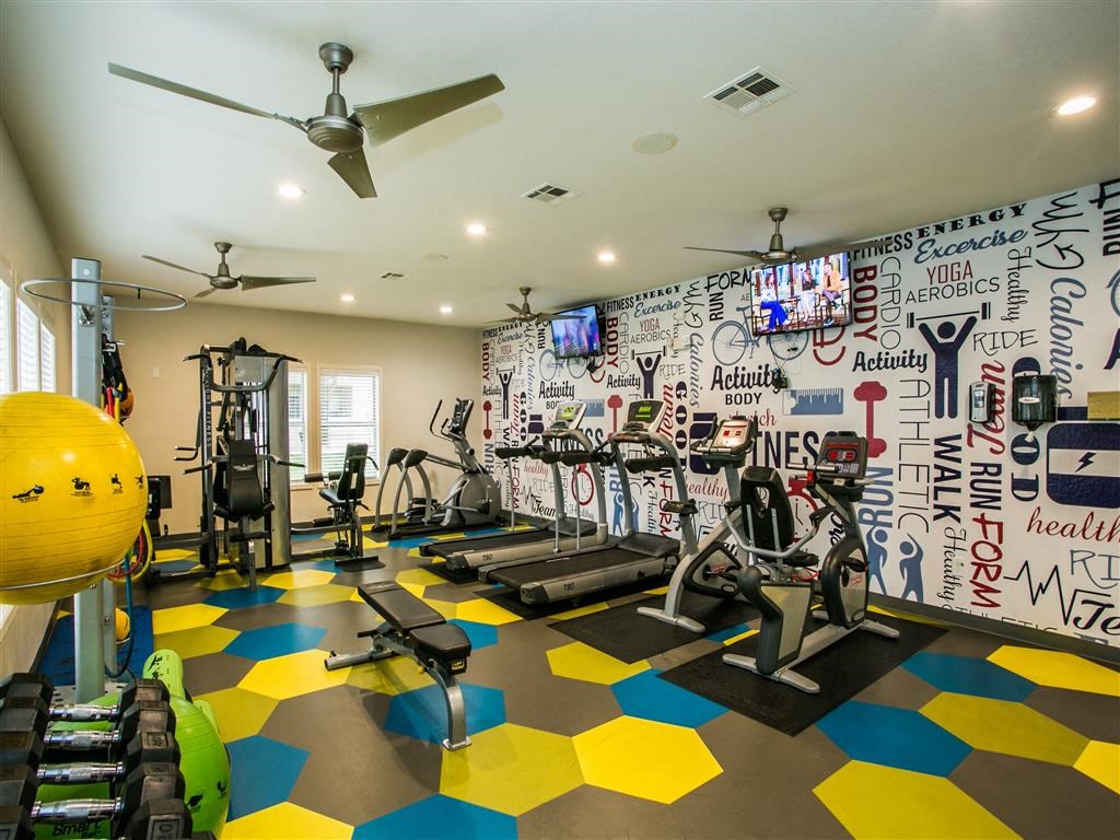 the gym is decorated with graffiti and exercise equipment