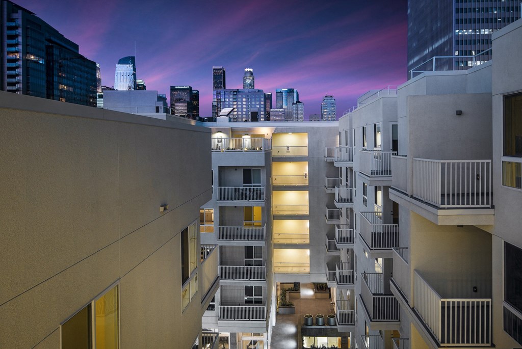 the city is seen from the roof of a building