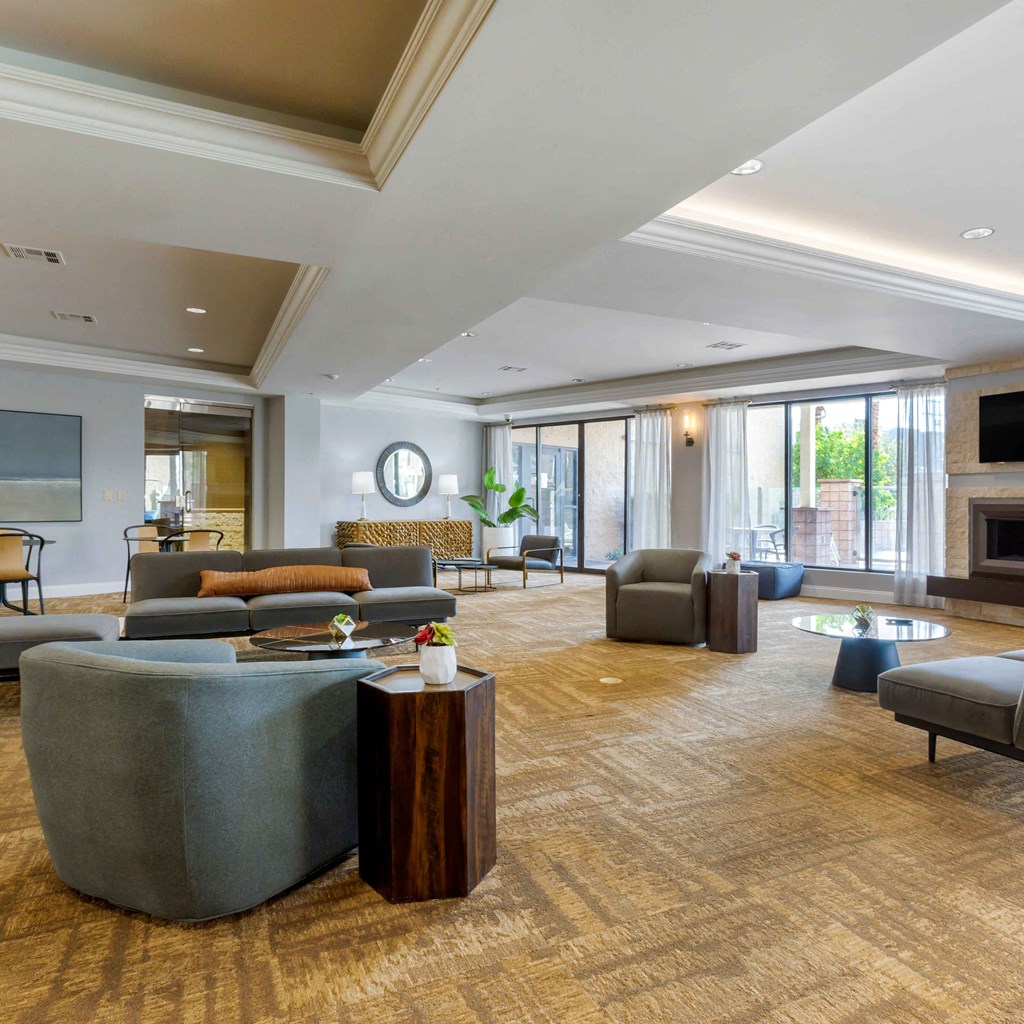 a large living room with couches and chairs and a fireplace at The Rays at Vegas Towers Apartments, Nevada, 89119