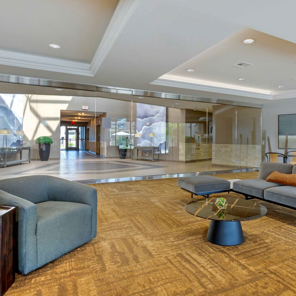 a lobby with couches and chairs and a table at The Rays at Vegas Towers Apartments, Las Vegas