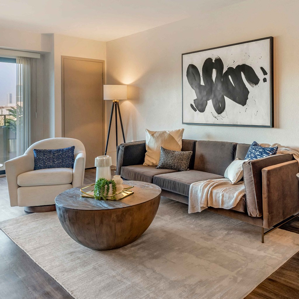 a living room with a couch and a table at The Rays at Vegas Towers Apartments, Nevada