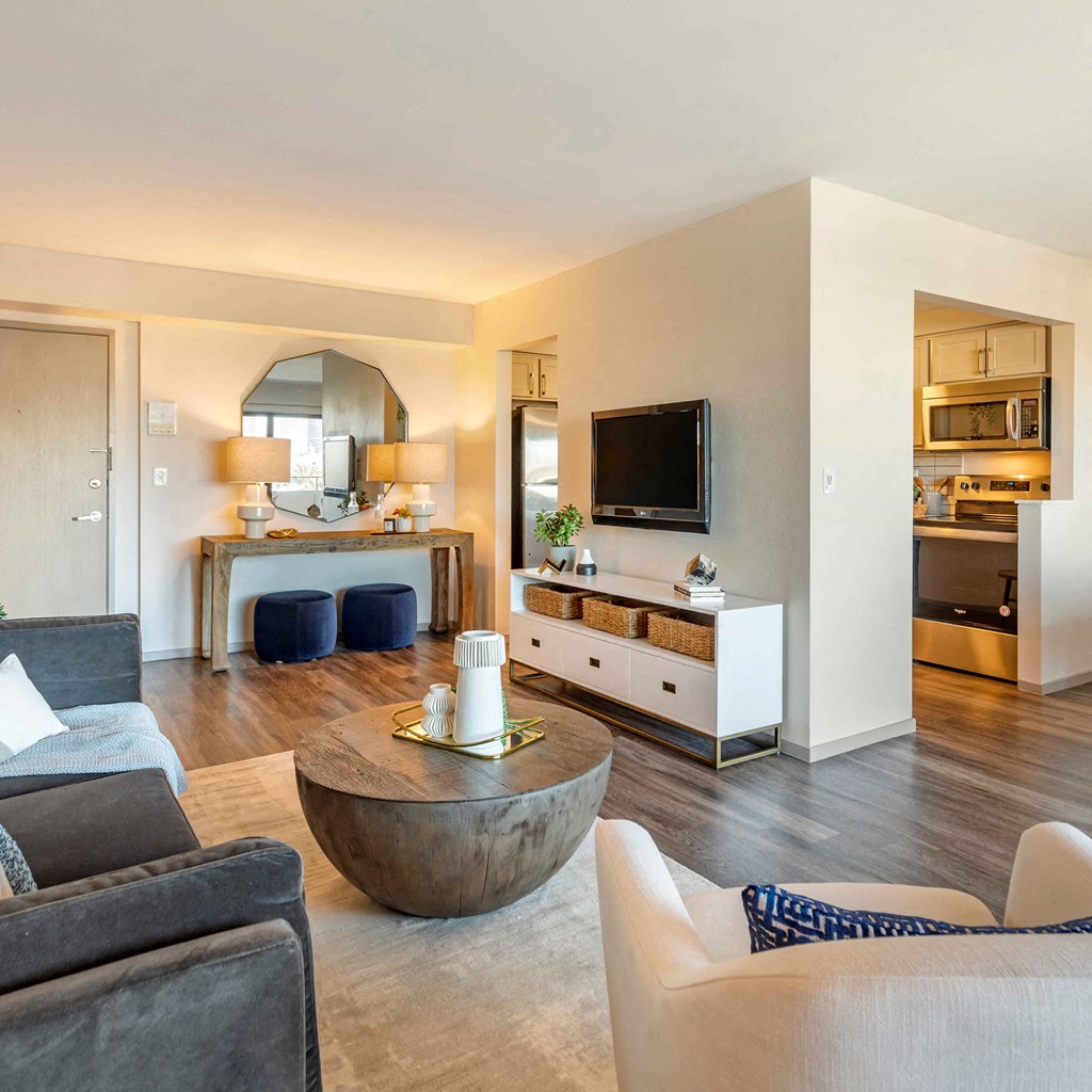 a living room with couches and a table at The Rays at Vegas Towers Apartments, Las Vegas