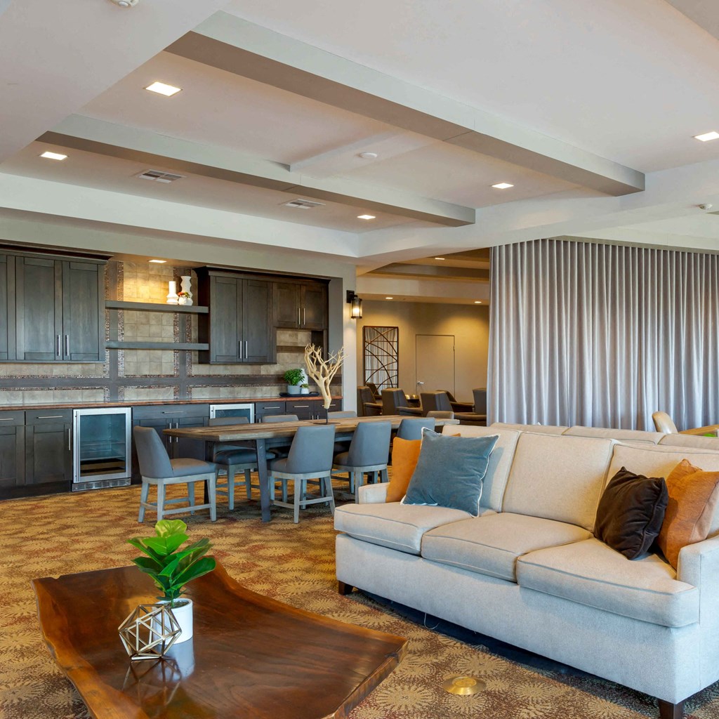 a living room with a couch and a table at The Rays at Vegas Towers Apartments, Las Vegas, 89119