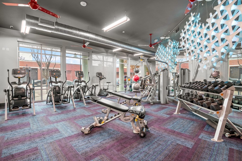 a gym with weights and cardio equipment  at South Side Flats, Dallas, 75215