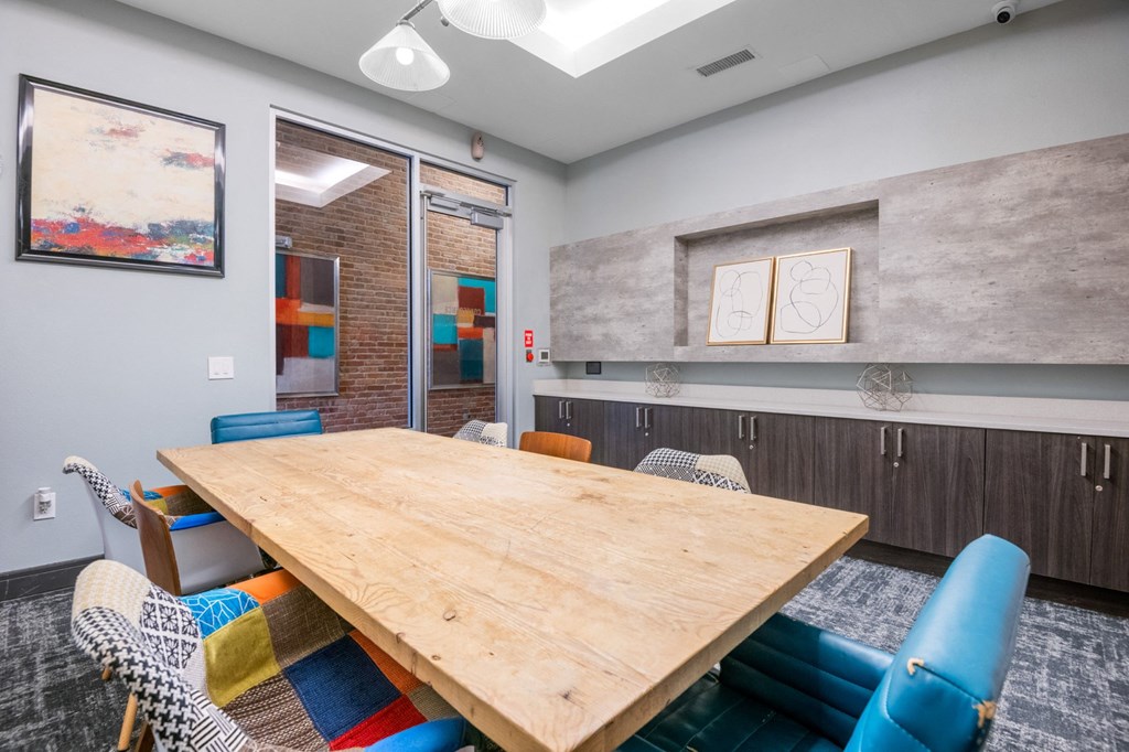 a conference room with a large wooden table and chairs at South Side Flats, Dallas, TX