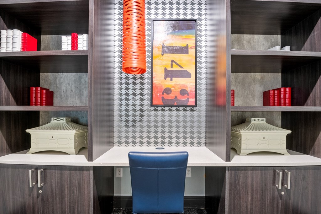 a display case with a blue chair in the middle of it at South Side Flats, Dallas