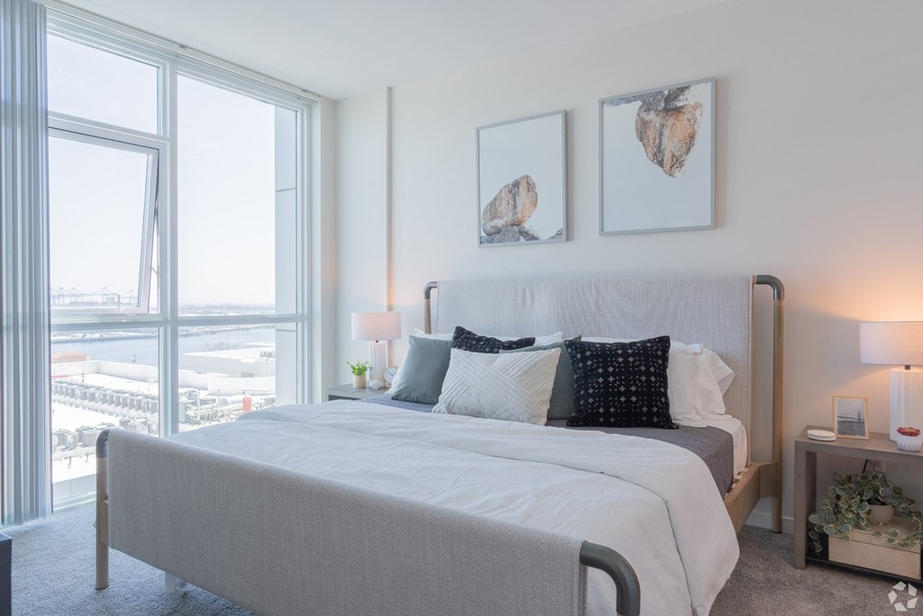 a bedroom with a large bed and a large window at Vue, Sand Pedro, CA 90731
