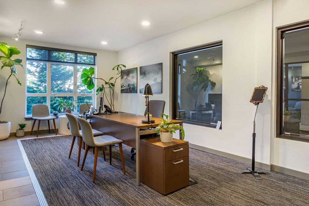 a workspace with a desk and chairs at 128 on State, Kirkland, 98033