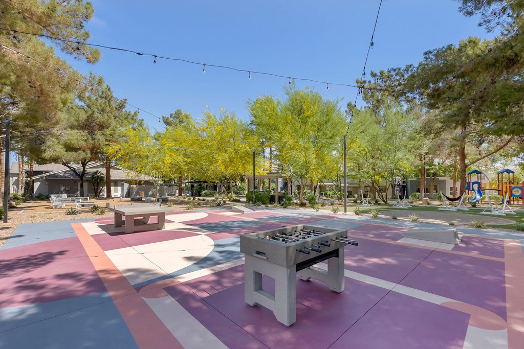 a park with a ping pong table and benches at Paisley and Pointe Apartments, Nevada, 89130