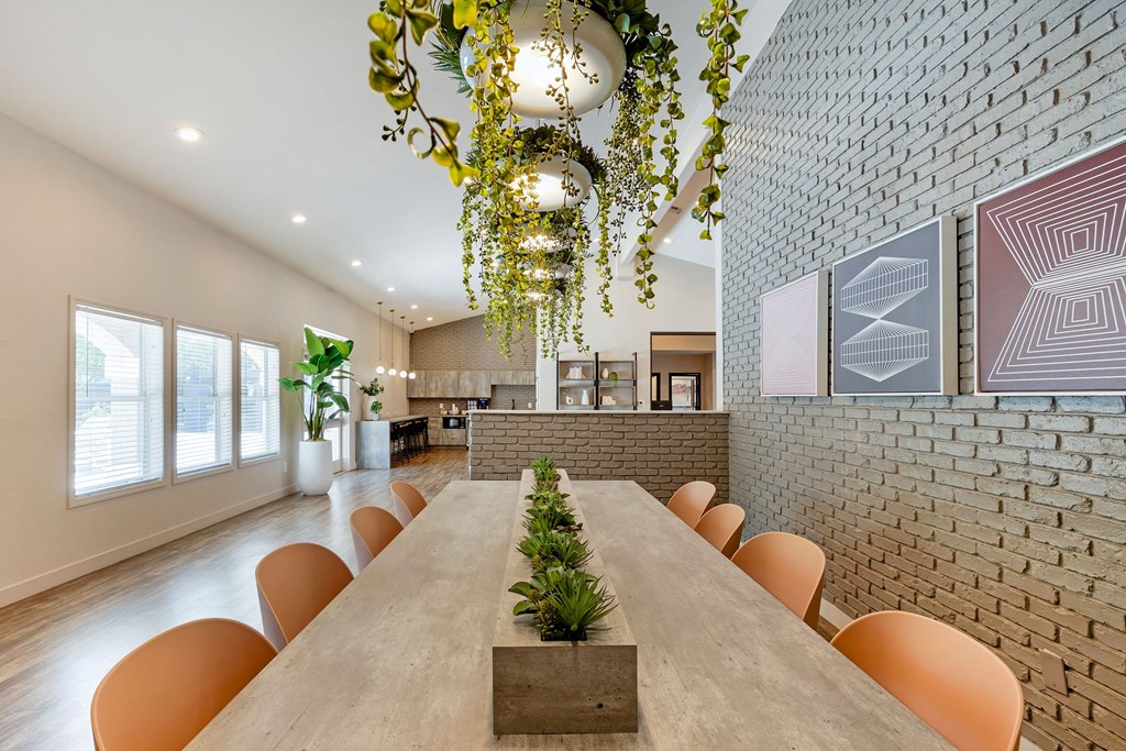a dining room with a long table and chairs at Paisley and Pointe Apartments, Nevada, 89130