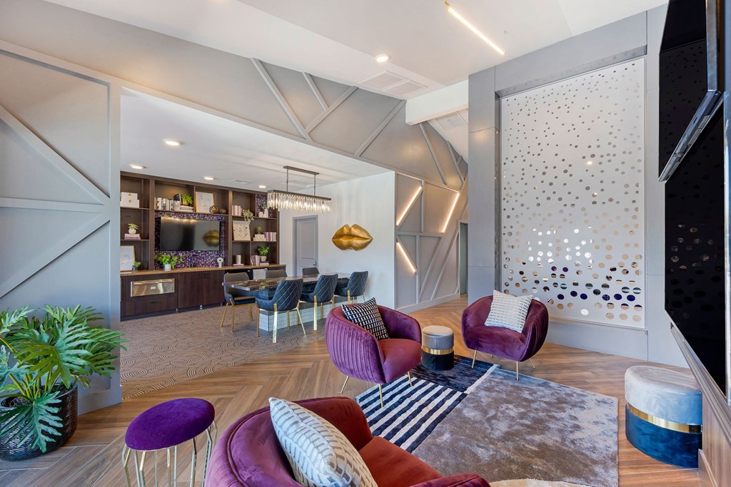 a living room with couches and chairs and a dining room with a bar at Paisley and Pointe Apartments, Las Vegas, NV 89130