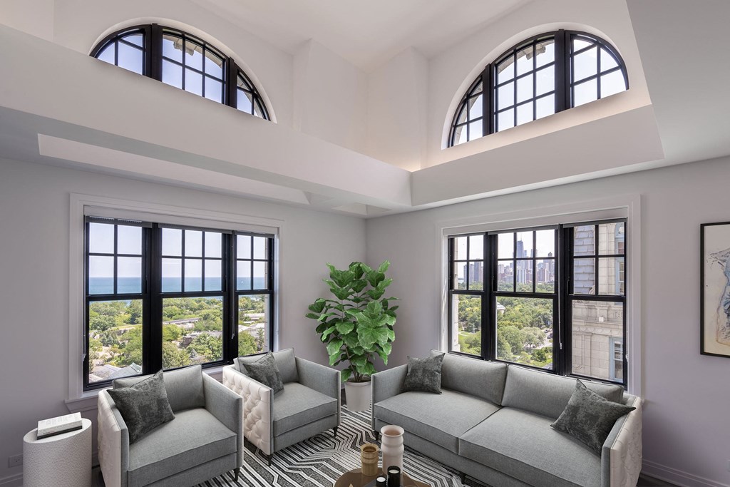 a living room with two couches and two windows  at The Belden Stratford, Chicago, 60614