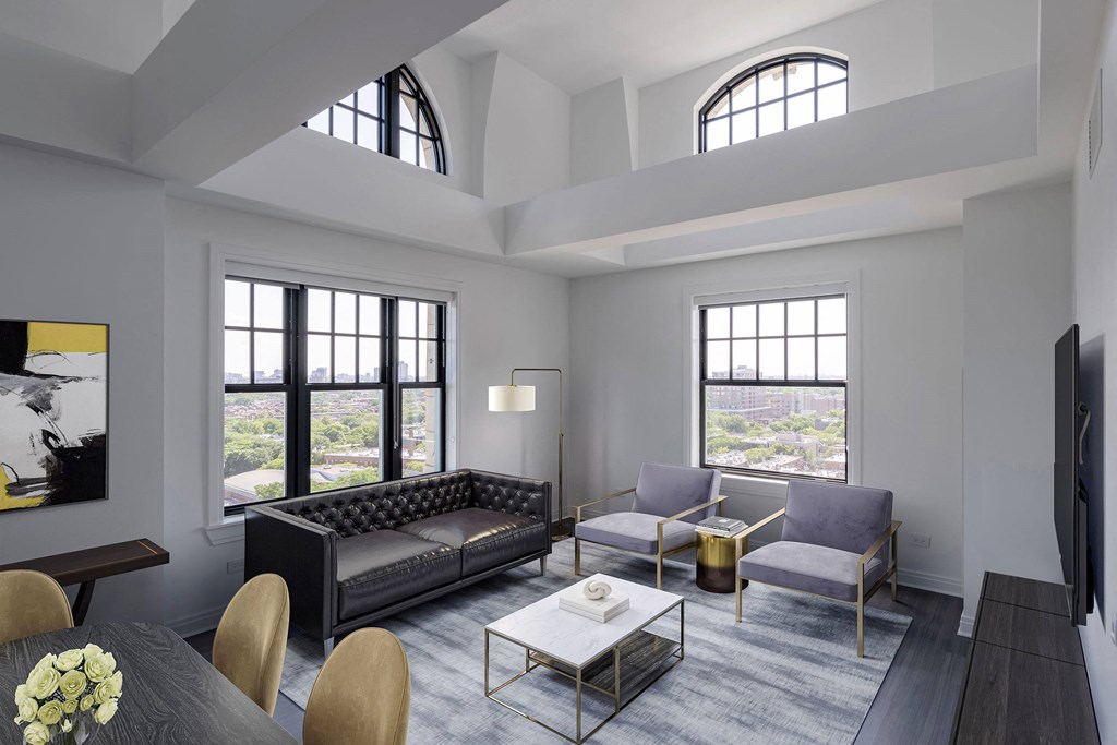 a living room with couches and a table  at The Belden Stratford, Chicago, IL