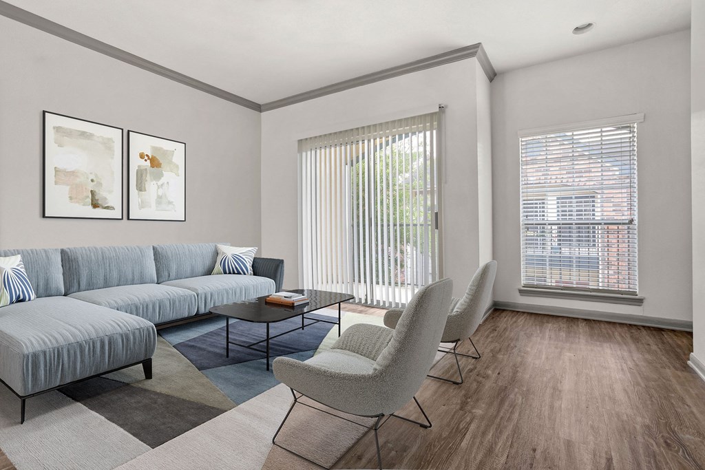 a living room with a couch and chairs and a window at Aston at Cinco Ranch, Katy, TX, 77450