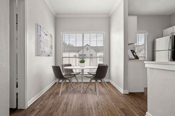 a dining room with a table and chairs and a window at Aston at Cinco Ranch, Katy, 77450