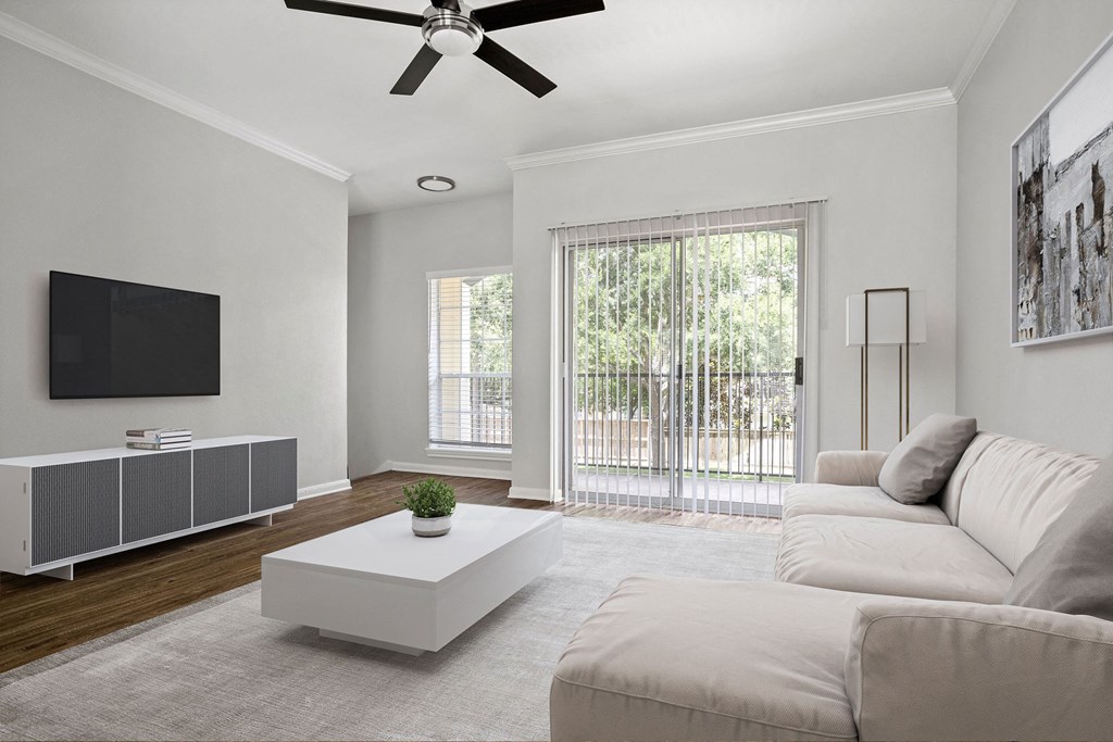 a living room with a couch and a coffee table at Aston at Cinco Ranch, Katy, 77450