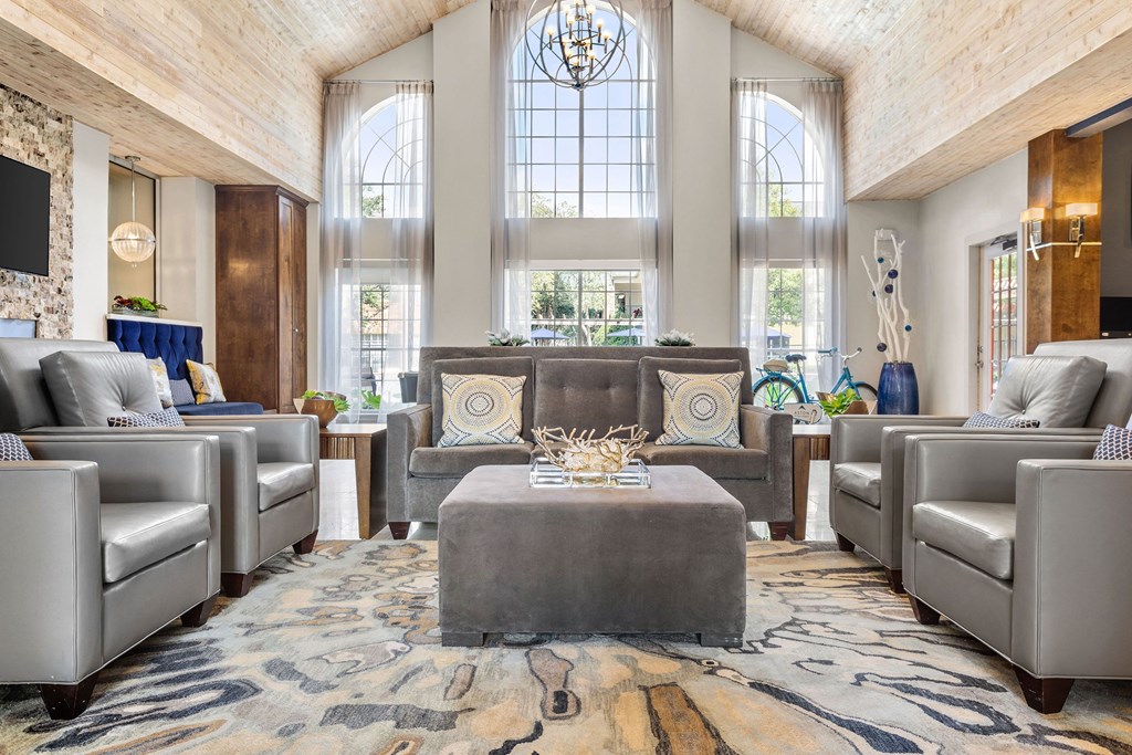 a lobby with couches and chairs and a table at Aston at Cinco Ranch, Katy, Texas