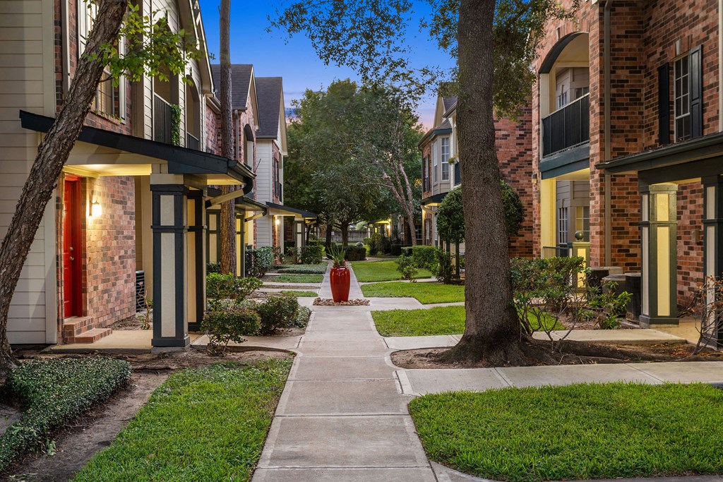 a red fire hydrant sitting in the middle of a sidewalk at Aston at Cinco Ranch, Texas, 77450