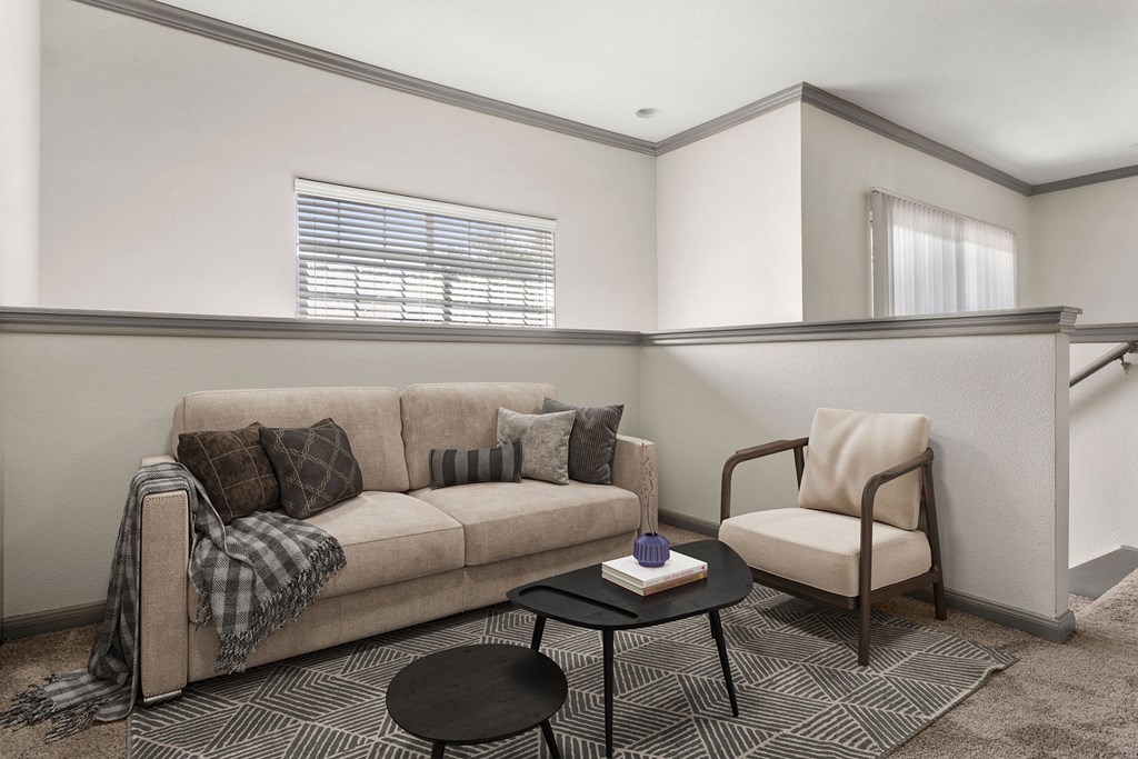 a living room with a couch and a chair at Aston at Cinco Ranch, Texas