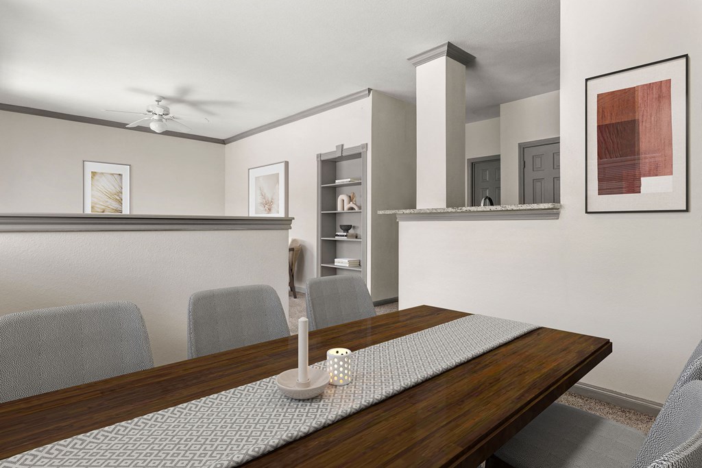 a dining room with a wooden table and chairs a dining room with a wooden table and chairs at Aston at Cinco Ranch, Texas, 77450