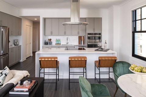 a kitchen with a white counter top and a kitchen island