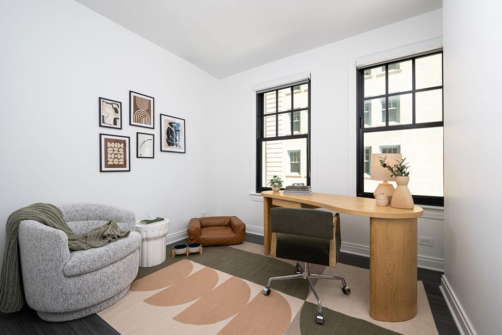 a home office with a chair and a desk and a window  at The Belden Stratford, Illinois, 60614