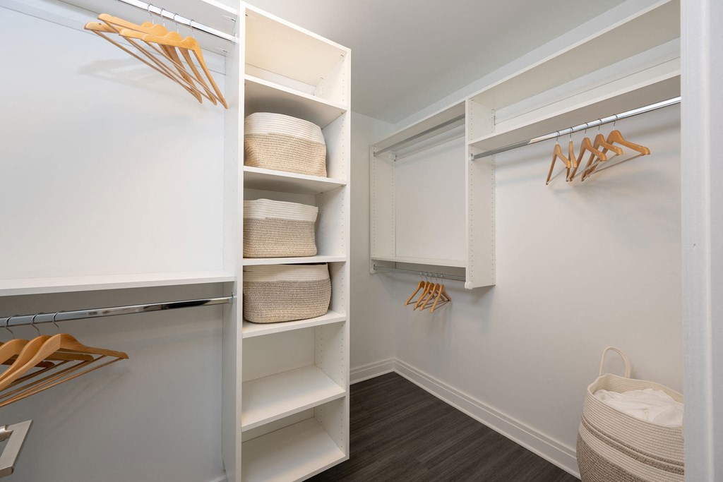 a walk in closet with shelves and baskets  at The Belden Stratford, Illinois