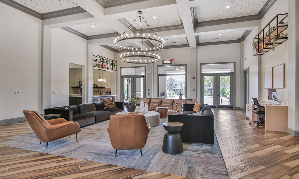 a large lobby with couches and chairs and a large chandelier at Sladestone Shadow Creek, Pearland, TX, 77584