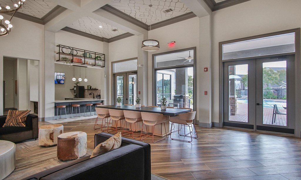 a large living room with a large dining room table and chairs at Sladestone Shadow Creek, Pearland