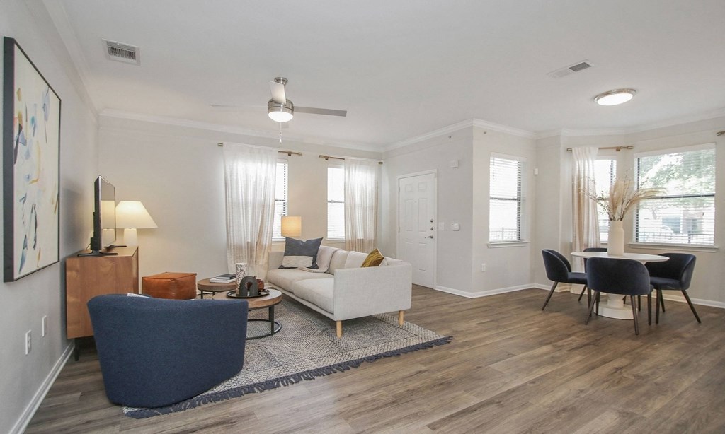 a living room with a couch and chairs and a dining room table at Sladestone Shadow Creek, Texas, 77584