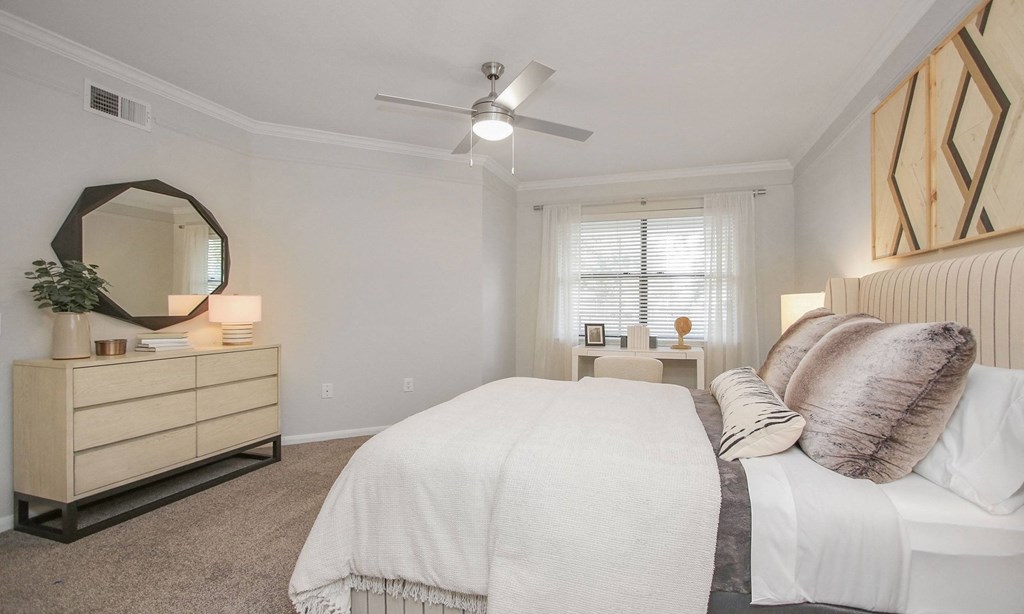 a bedroom with a large bed and a ceiling fan at Sladestone Shadow Creek, Pearland, TX, 77584