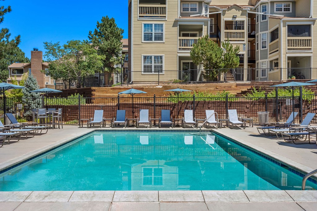 our apartments have a swimming pool with chairs and umbrellas our apartments have a swimming pool with chairs and umbrellas at Arcadia Apartments, Colorado