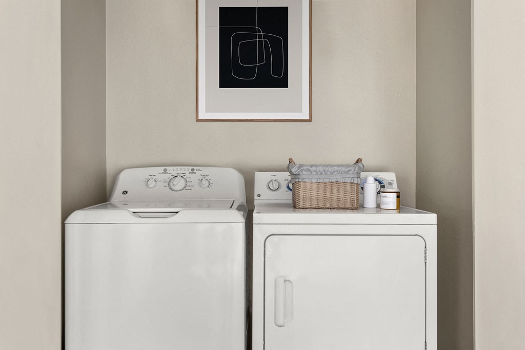 a washer and dryer in a laundry room at Arcadia Apartments, Centennial