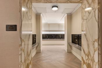 a view of a hallway with marble walls and a display of watches in a store  at The Belden Stratford, Illinois