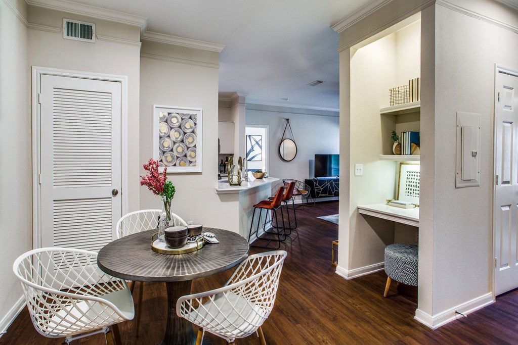 a living room and dining room with a table and chairs at Carrington at Barker Cypress, Texas, 77433