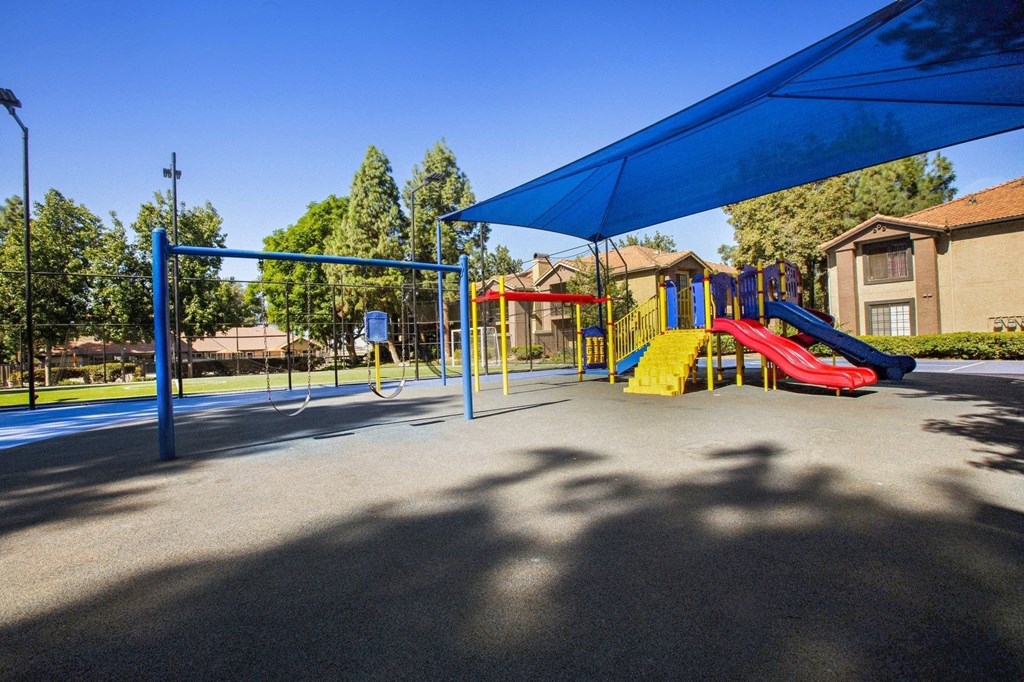 a playground with slides and swings  at Citrine Hills, Ontario, CA
