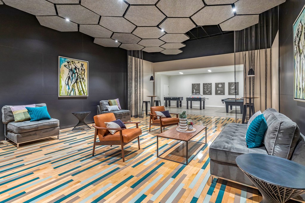 a living room with couches and chairs and a table