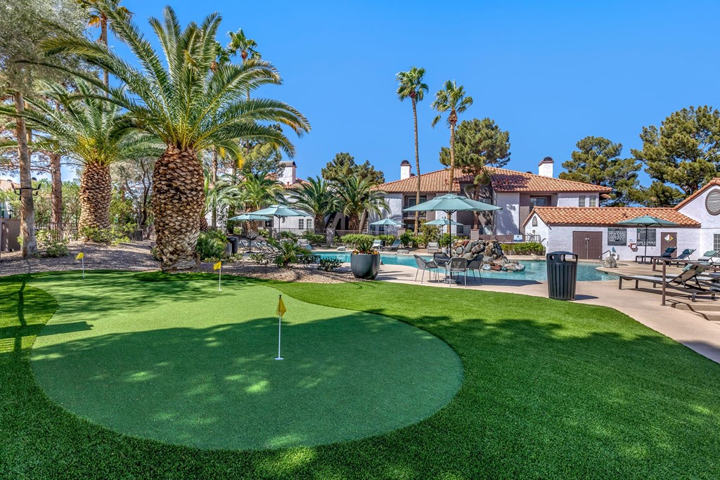 a putting green with a golf ball on top of it
