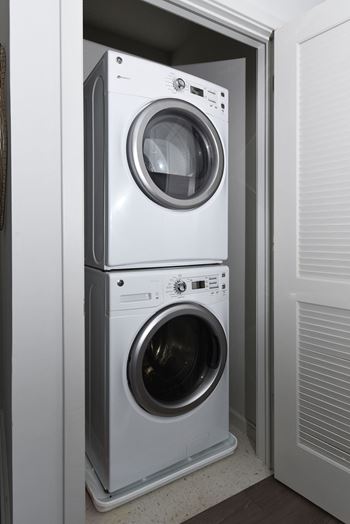 a front load washer and dryer in a laundry room at Heights at Glen Mills, Glen Mills