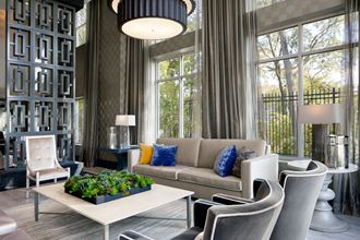a living room filled with furniture and a large window Heights at Glen Mills, Pennsylvania - Photo Gallery 3