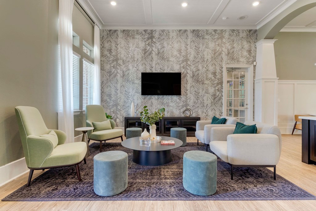 a living room with couches and chairs and a television at Madison on the Meadow, Stafford, Texas