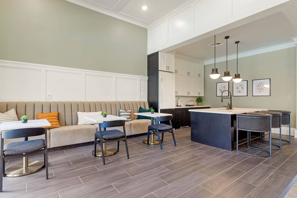 a dining room and kitchen with tables and chairs at Madison on the Meadow, Texas, 77477