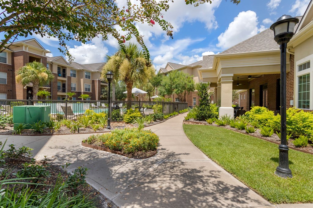 walking path to apartment buildings at Madison on the Meadow, Stafford, Texas
